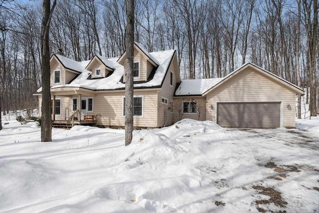 2508 Terpening Rd, Harbor Springs, MI 49740 - cape cod-style house featuring an attached garage