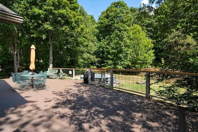 03675 Bc/Ej Rd, East Jordan, MI 49727 - view of patio with a wooden deck and outdoor dining area