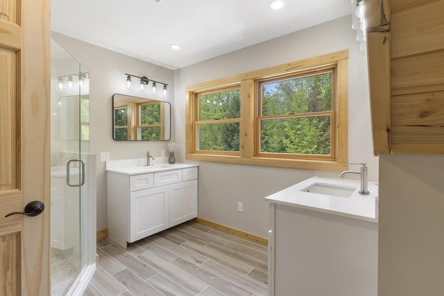 03675 Bc/Ej Rd, East Jordan, MI 49727 - full bath with vanity, a shower stall, baseboards, recessed lighting, and wood finished floors