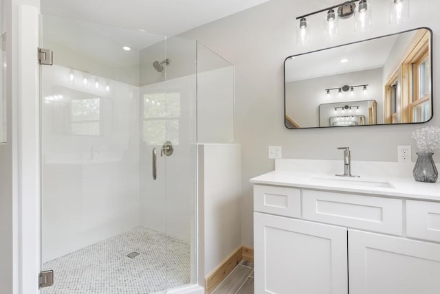 03675 Bc/Ej Rd, East Jordan, MI 49727 - full bath with a stall shower, vanity, wood finished floors, and recessed lighting