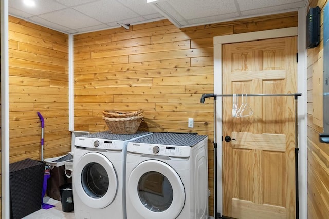 03675 Bc/Ej Rd, East Jordan, MI 49727 - washroom featuring washing machine and dryer and wooden walls