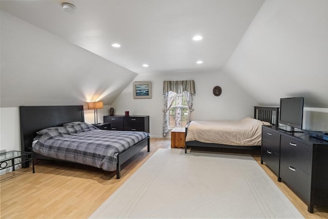 4460 E Fontenoy St, Boyne City, MI 49712 - bedroom with light wood-style floors, lofted ceiling, and recessed lighting