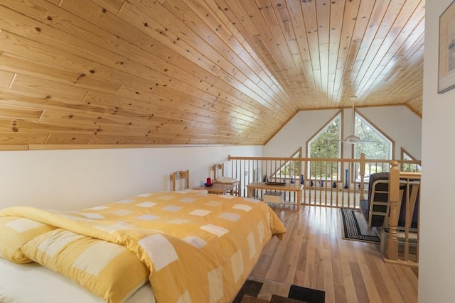 4460 E Fontenoy St, Boyne City, MI 49712 - bedroom with wooden ceiling, lofted ceiling, and hardwood / wood-style floors