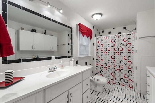 4460 E Fontenoy St, Boyne City, MI 49712 - bathroom featuring vanity, a shower with shower curtain, tile patterned flooring, toilet, and decorative backsplash