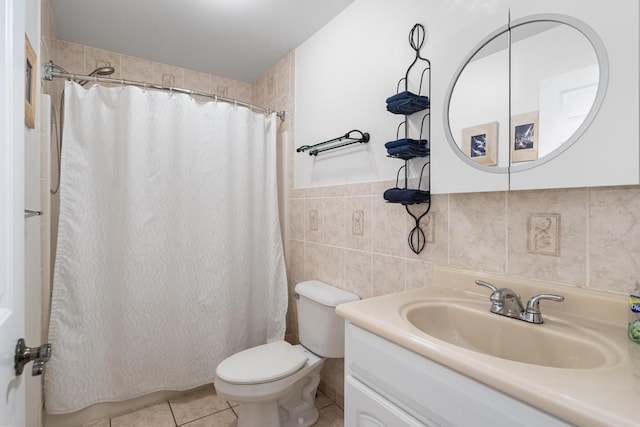 4460 E Fontenoy St, Boyne City, MI 49712 - full bath featuring toilet, vanity, tile walls, tile patterned flooring, and curtained shower