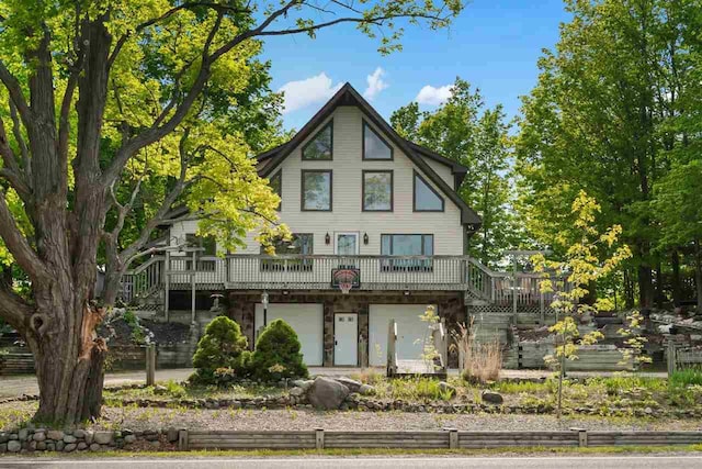 10370 Boyne City Rd, Charlevoix, MI 49720 - view of front of home featuring stairway and a wooden deck