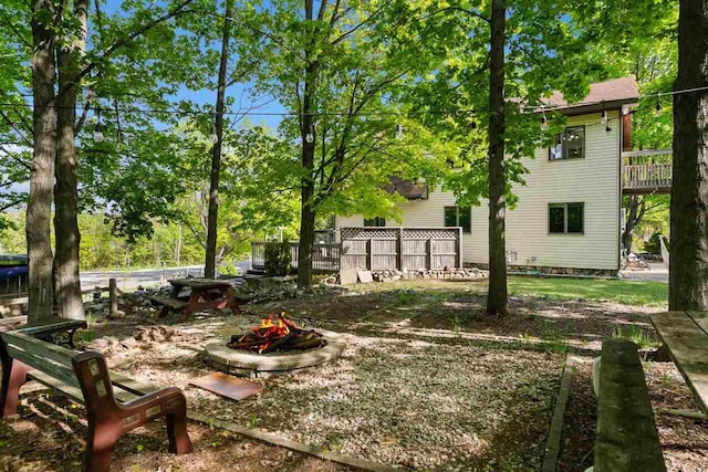 10370 Boyne City Rd, Charlevoix, MI 49720 - view of yard with an outdoor fire pit