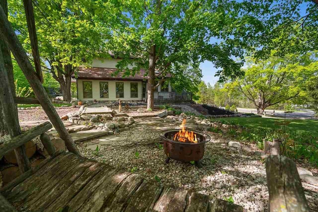 10370 Boyne City Rd, Charlevoix, MI 49720 - view of yard featuring an outdoor fire pit