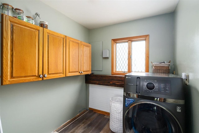 10370 Boyne City Rd, Charlevoix, MI 49720 - washroom with washer / clothes dryer, cabinet space, dark wood-style floors, and baseboards