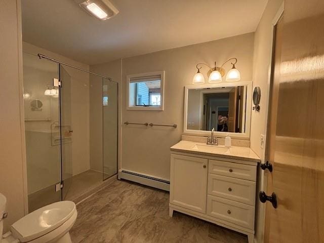 1020 Waukazoo, Petoskey, MI 49770 - bathroom featuring baseboard heating, vanity, a shower stall, and toilet
