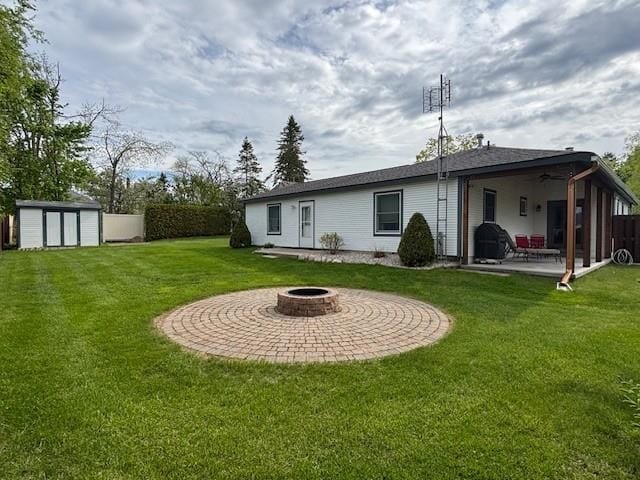 1020 Waukazoo, Petoskey, MI 49770 - rear view of property with a patio, a fire pit, and ceiling fan