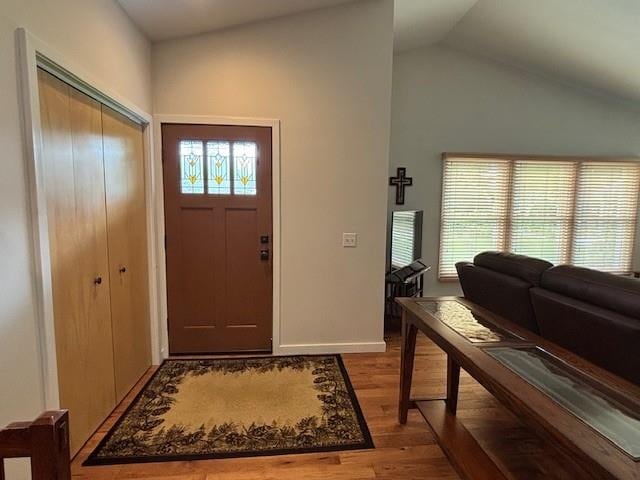 1020 Waukazoo, Petoskey, MI 49770 - entryway with light wood-type flooring, lofted ceiling, and baseboards