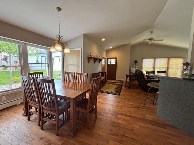 1020 Waukazoo, Petoskey, MI 49770 - dining area with lofted ceiling, wood finished floors, a ceiling fan, recessed lighting, and a baseboard radiator