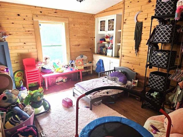 05671 N M-66 N, Charlevoix, MI 49720 - bedroom featuring wooden walls, wood finished floors, and lofted ceiling