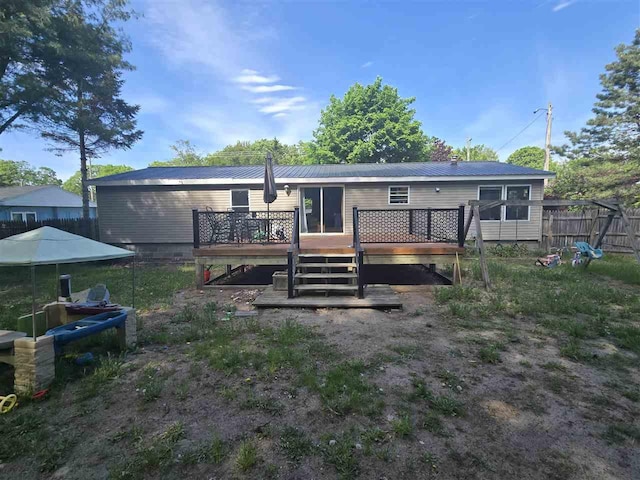 05671 N M-66 N, Charlevoix, MI 49720 - rear view of property with a wooden deck and metal roof
