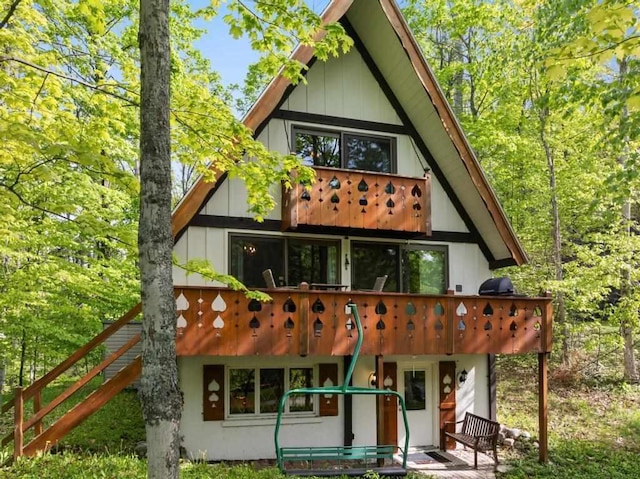 426 Chamonix Ln, Harbor Springs, MI 49740 - back of property with a balcony