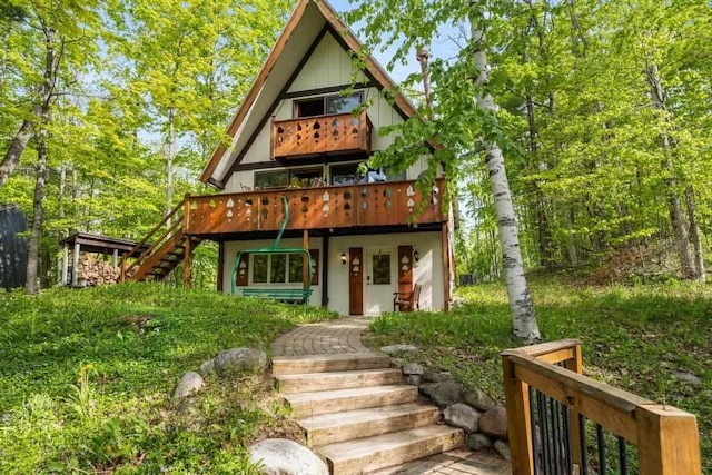 426 Chamonix Ln, Harbor Springs, MI 49740 - back of house featuring stairway and a deck