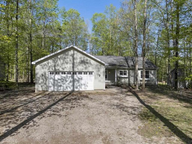 1080 Owen Dr, Petoskey, MI 49770 - view of front of property featuring driveway and a garage