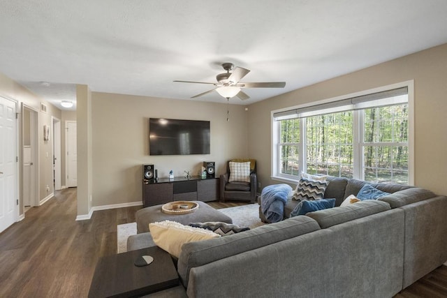 1080 Owen Dr, Petoskey, MI 49770 - living room with dark wood-type flooring, ceiling fan, and baseboards