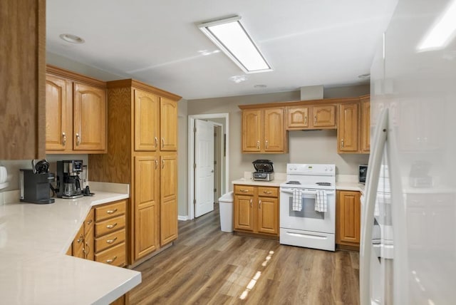 1080 Owen Dr, Petoskey, MI 49770 - kitchen featuring white appliances, light countertops, and light wood-type flooring