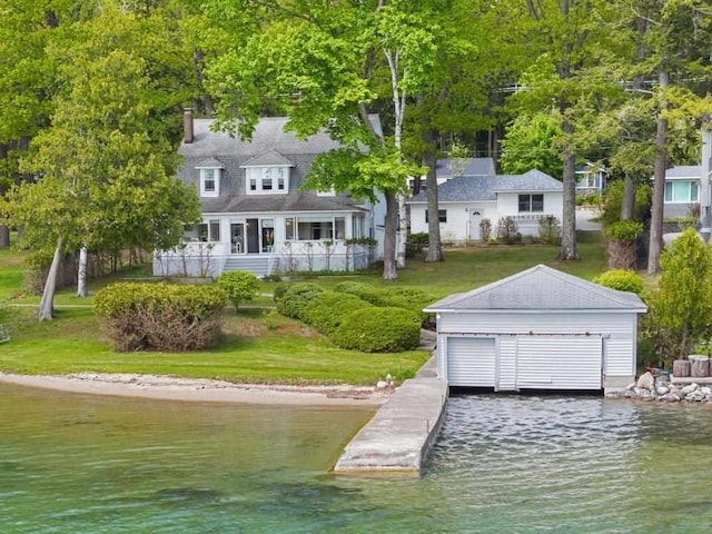 1788 N Shore Dr, Walloon Lake, MI 49796 - dock area with a water view and a yard