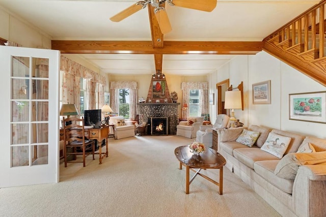 1788 N Shore Dr, Walloon Lake, MI 49796 - living room featuring carpet floors, a ceiling fan, beamed ceiling, and a brick fireplace