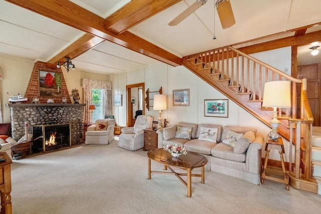 1788 N Shore Dr, Walloon Lake, MI 49796 - carpeted living area with a ceiling fan, stairs, beam ceiling, and a brick fireplace