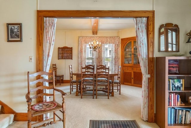 1788 N Shore Dr, Walloon Lake, MI 49796 - carpeted dining room with a chandelier and beam ceiling