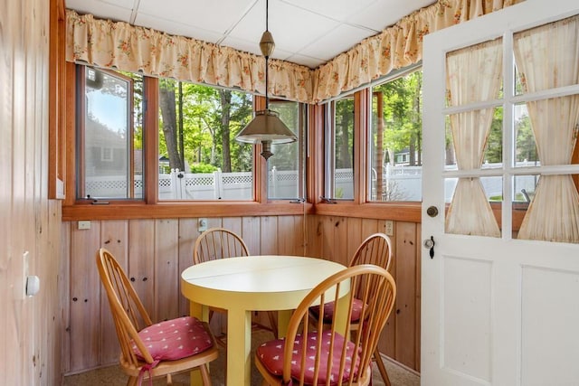 1788 N Shore Dr, Walloon Lake, MI 49796 - sunroom with wood walls and a paneled ceiling