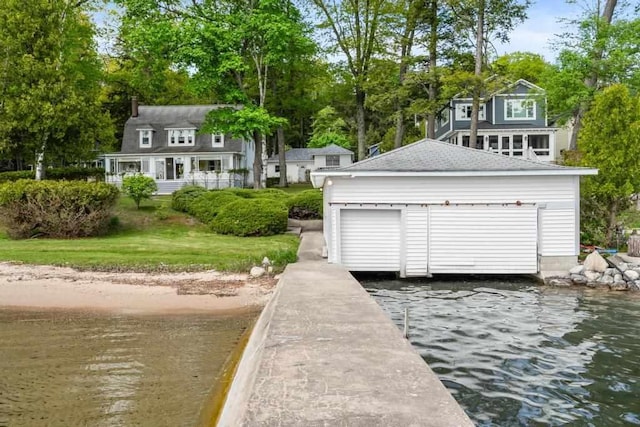 1788 N Shore Dr, Walloon Lake, MI 49796 - dock with a water view and view of wooded area