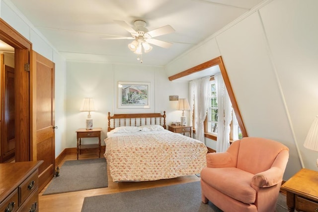 1788 N Shore Dr, Walloon Lake, MI 49796 - bedroom with light wood-type flooring, ornamental molding, and ceiling fan