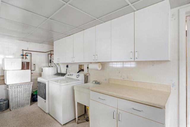 1788 N Shore Dr, Walloon Lake, MI 49796 - laundry area with cabinet space, separate washer and dryer, and water heater
