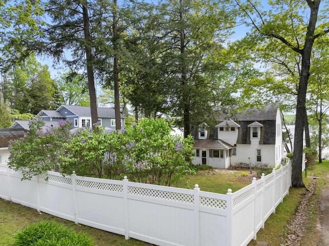 1788 N Shore Dr, Walloon Lake, MI 49796 - back of house with a fenced front yard