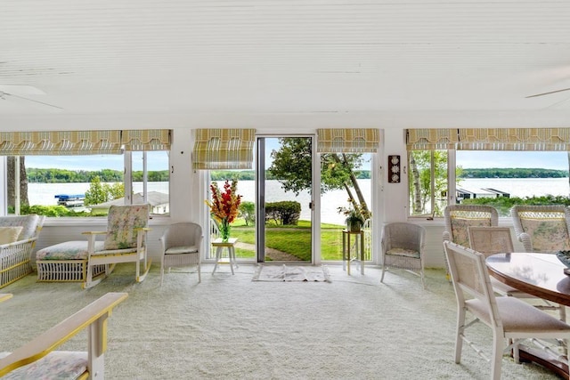 1788 N Shore Dr, Walloon Lake, MI 49796 - sunroom / solarium with healthy amount of natural light and a water view