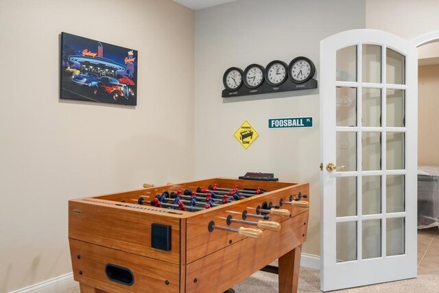 6707 Cottage Ct Unit 40, Bay Harbor, MI 49770 - recreation room featuring baseboards
