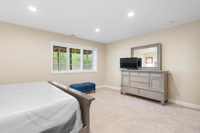 6707 Cottage Ct Unit 40, Bay Harbor, MI 49770 - bedroom with light carpet, baseboards, and recessed lighting