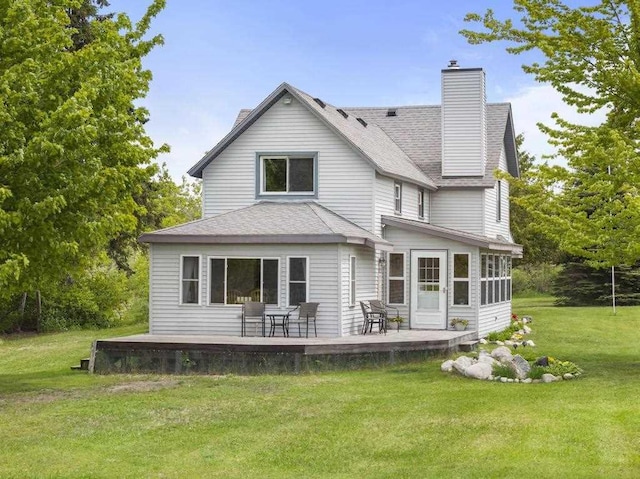 10545 Heilman Rd, Levering, MI 49755 - back of property with a chimney, a lawn, and a shingled roof