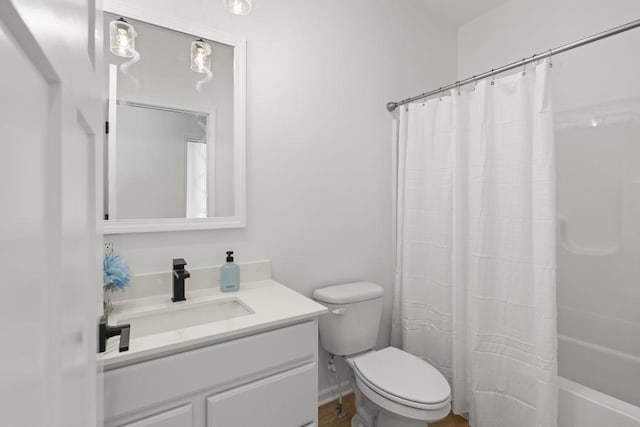 7748 Sophies Way, Harbor Springs, MI 49740 - bathroom with vanity, toilet, and shower / tub combo