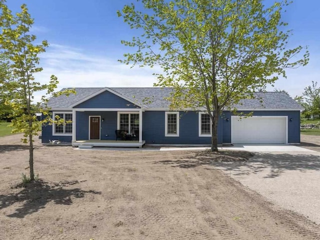 7748 Sophies Way, Harbor Springs, MI 49740 - ranch-style home featuring driveway, a garage, and a porch