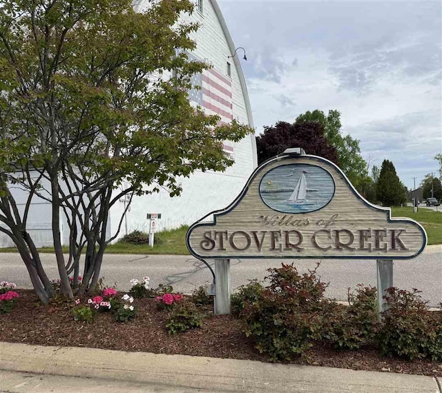 13435 Creekside Ln Unit 4, Charlevoix, MI 49720 - view of community / neighborhood sign