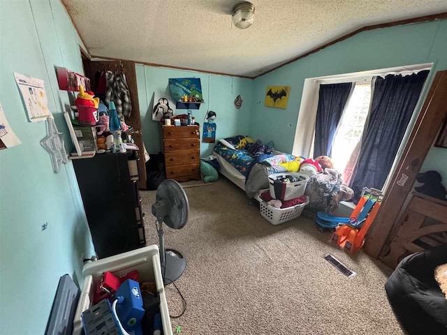 59 Tamarack Dr, East Jordan, MI 49727 - bedroom featuring carpet, a textured ceiling, and vaulted ceiling