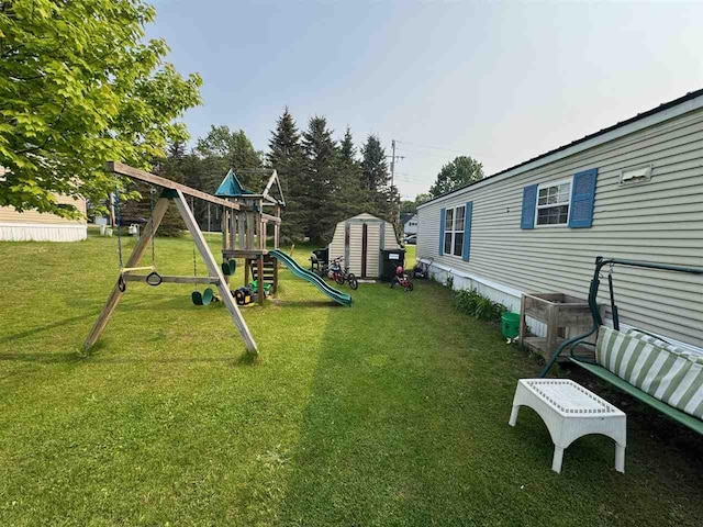 59 Tamarack Dr, East Jordan, MI 49727 - view of grassy yard featuring a playground