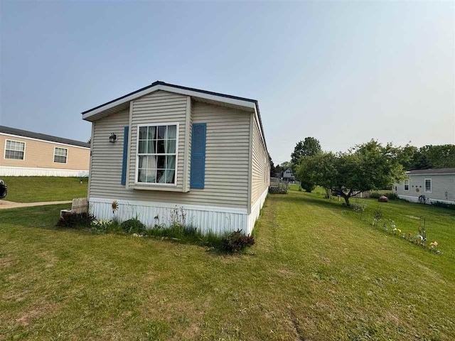 59 Tamarack Dr, East Jordan, MI 49727 - view of side of property with a lawn
