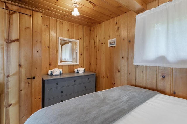 21677 Bluffs Hwy, Onaway, MI 49765 - bedroom featuring wooden ceiling and wooden walls