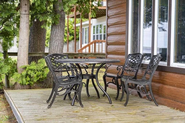 21677 Bluffs Hwy, Onaway, MI 49765 - wooden deck with outdoor dining area