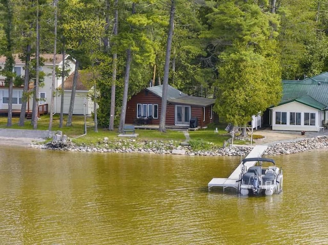 21677 Bluffs Hwy, Onaway, MI 49765 - dock area with a water view and a yard