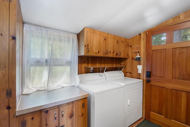 21677 Bluffs Hwy, Onaway, MI 49765 - washroom with cabinet space and washing machine and clothes dryer
