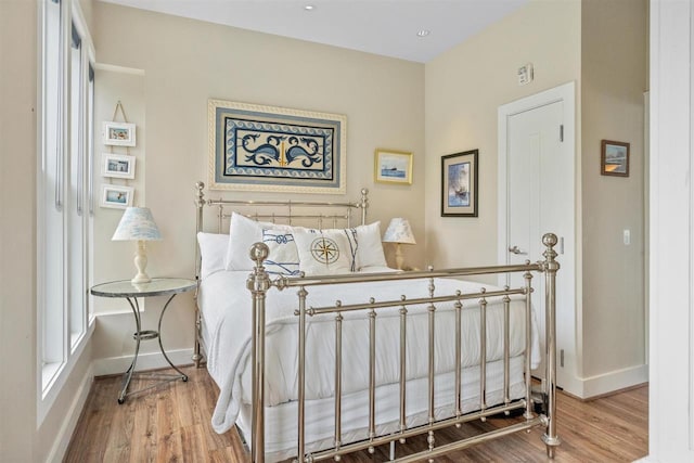 824 Vista Dr Unit 64, Bay Harbor, MI 49770 - bedroom featuring wood finished floors and baseboards