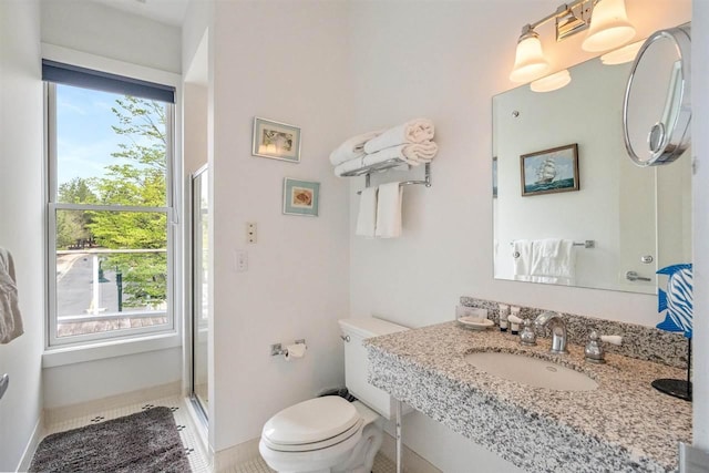 824 Vista Dr Unit 64, Bay Harbor, MI 49770 - full bathroom with toilet, vanity, a stall shower, and baseboards