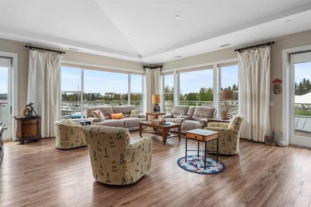 824 Vista Dr Unit 64, Bay Harbor, MI 49770 - living room with vaulted ceiling, wood finished floors, and recessed lighting
